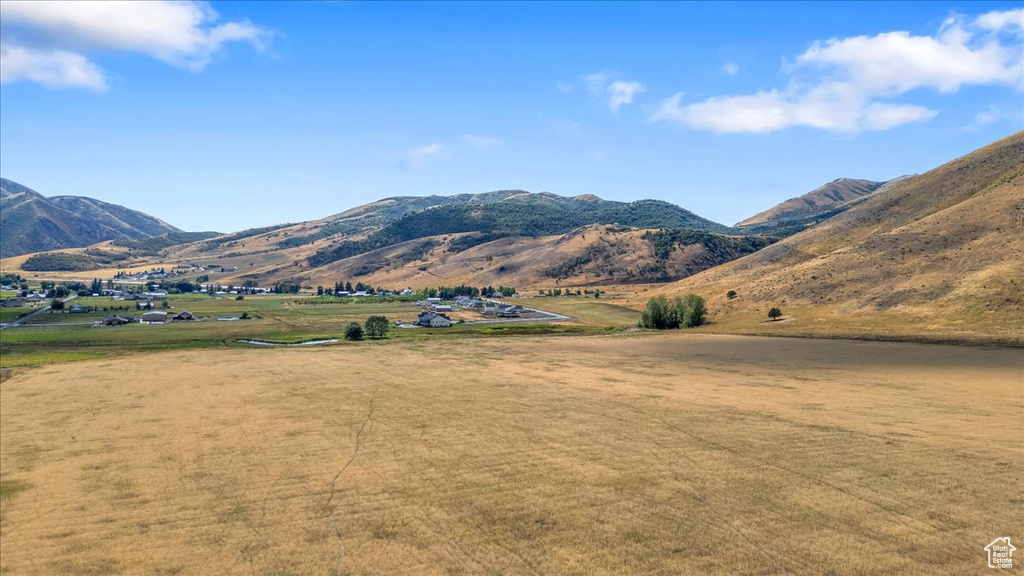 Property view of mountains with a rural view