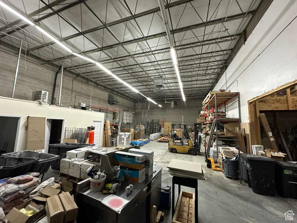 Miscellaneous room with concrete floors and a workshop area