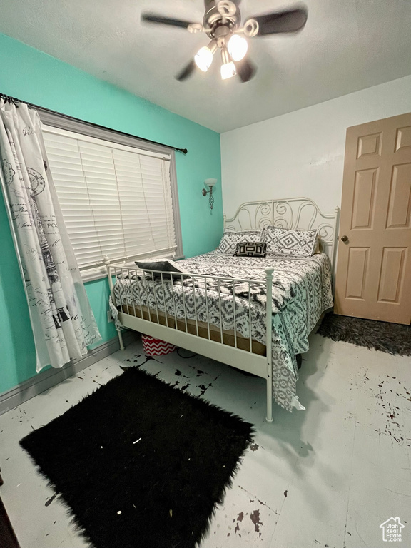 Unfurnished bedroom with ceiling fan