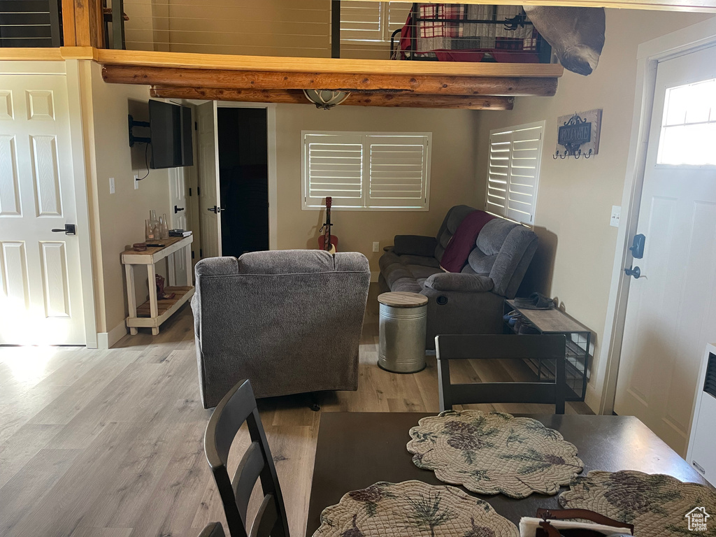 Living room with hardwood / wood-style flooring