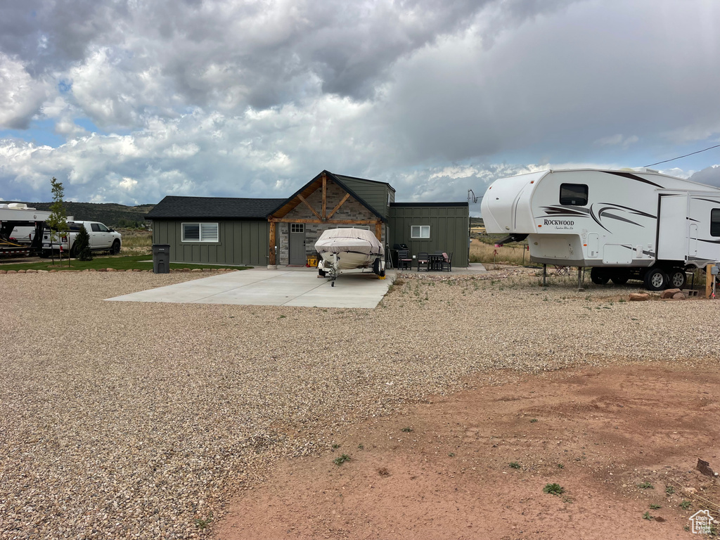 View of front of home with an outbuilding