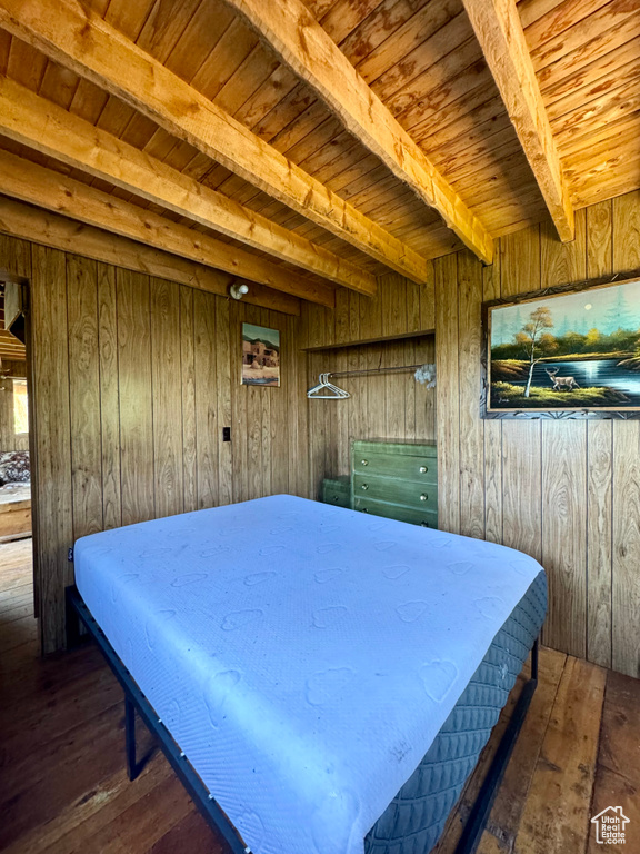 Interior space with beam ceiling, wooden walls, wood-type flooring, billiards, and wooden ceiling