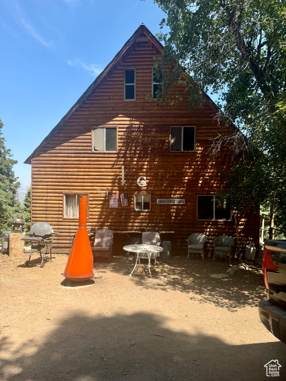 Rear view of property featuring a patio