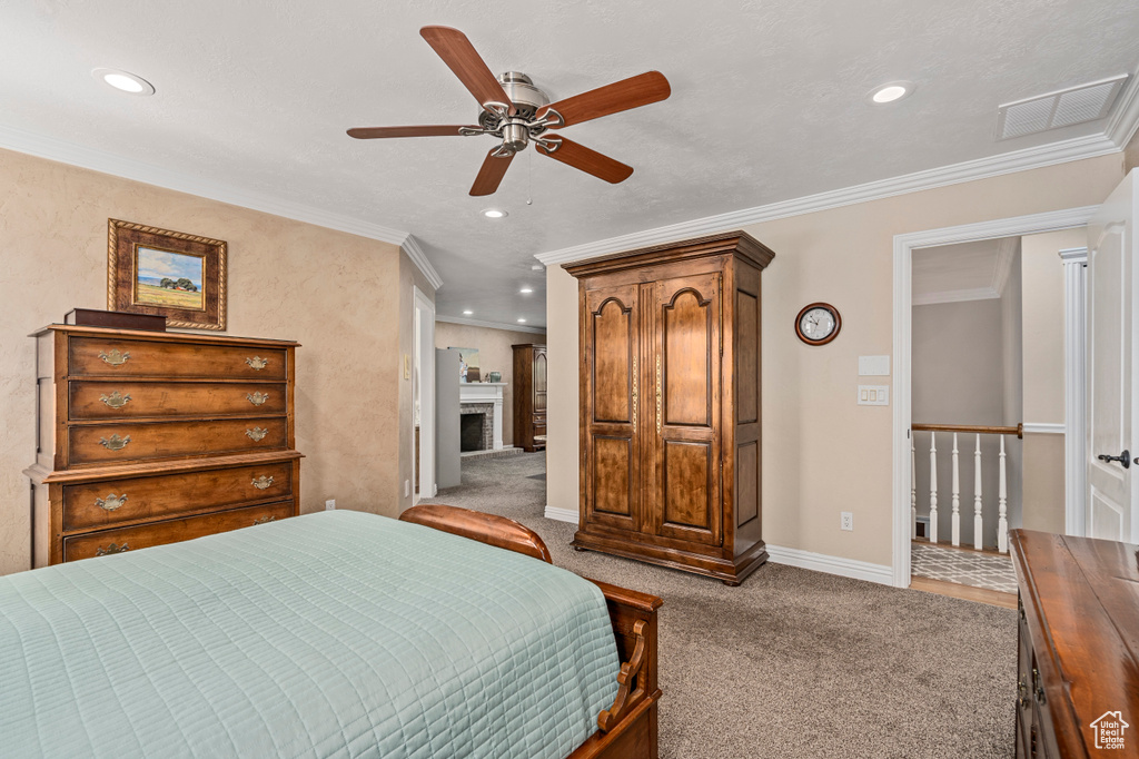 Bedroom featuring light colored carpet, crown molding, and ceiling fan