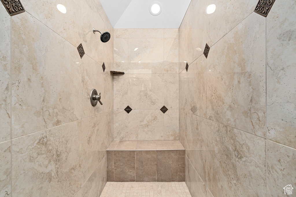 Bathroom featuring a tile shower