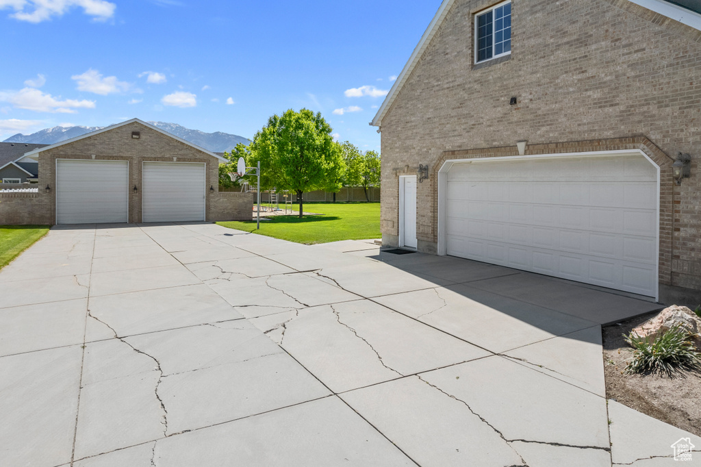 Garage with a lawn and a mountain view