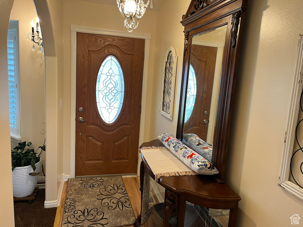 Entrance foyer with a notable chandelier