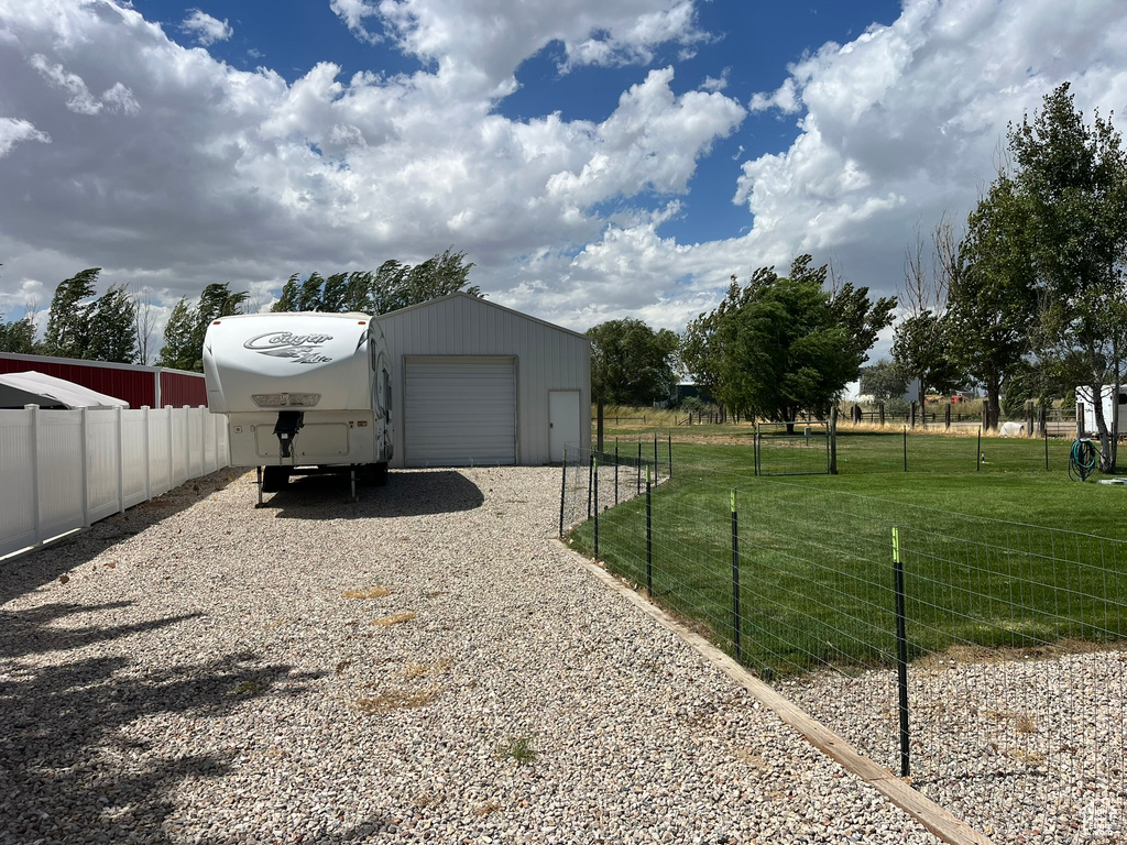 Exterior space with an outdoor structure and a garage