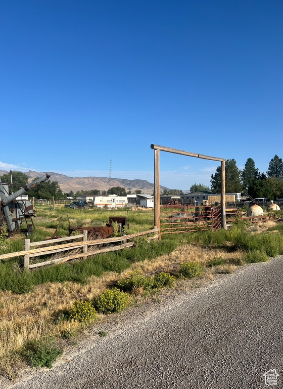 Surrounding community featuring a rural view and a mountain view