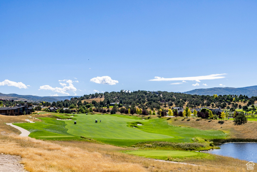 View of community featuring a water and mountain view