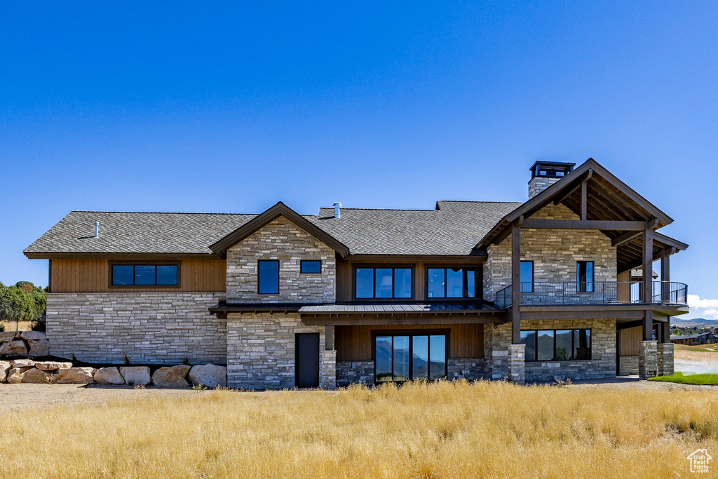 Rear view of house featuring a balcony