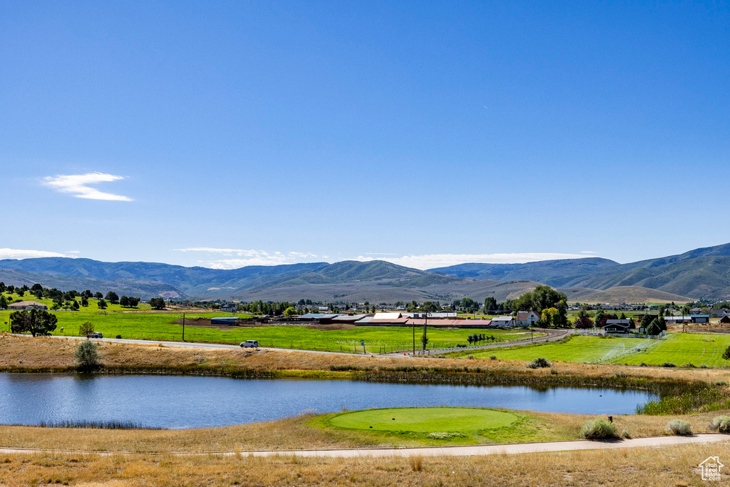 View of water feature with a mountain view