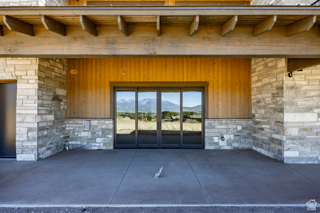 Doorway to property featuring a patio area and a mountain view