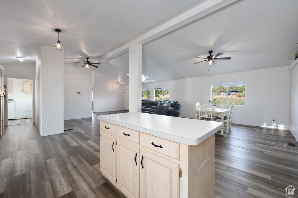 Kitchen with vaulted ceiling with beams, dark hardwood / wood-style floors, and ceiling fan