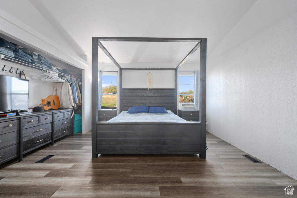 Bedroom featuring a closet and wood-type flooring