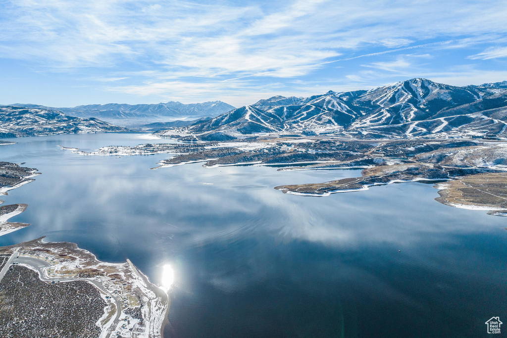 Property view of mountains with a water view