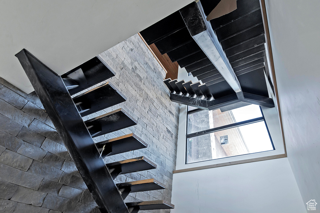 Stairway featuring beam ceiling