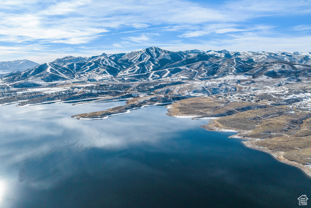 Property view of mountains with a water view