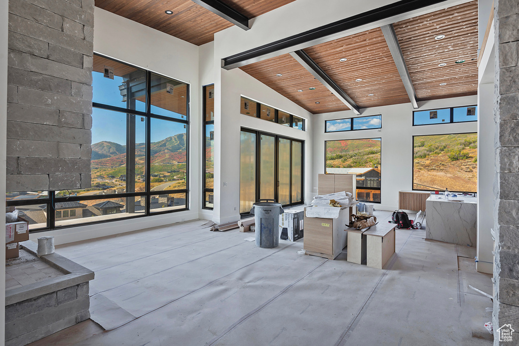 Interior space with a mountain view and exterior kitchen