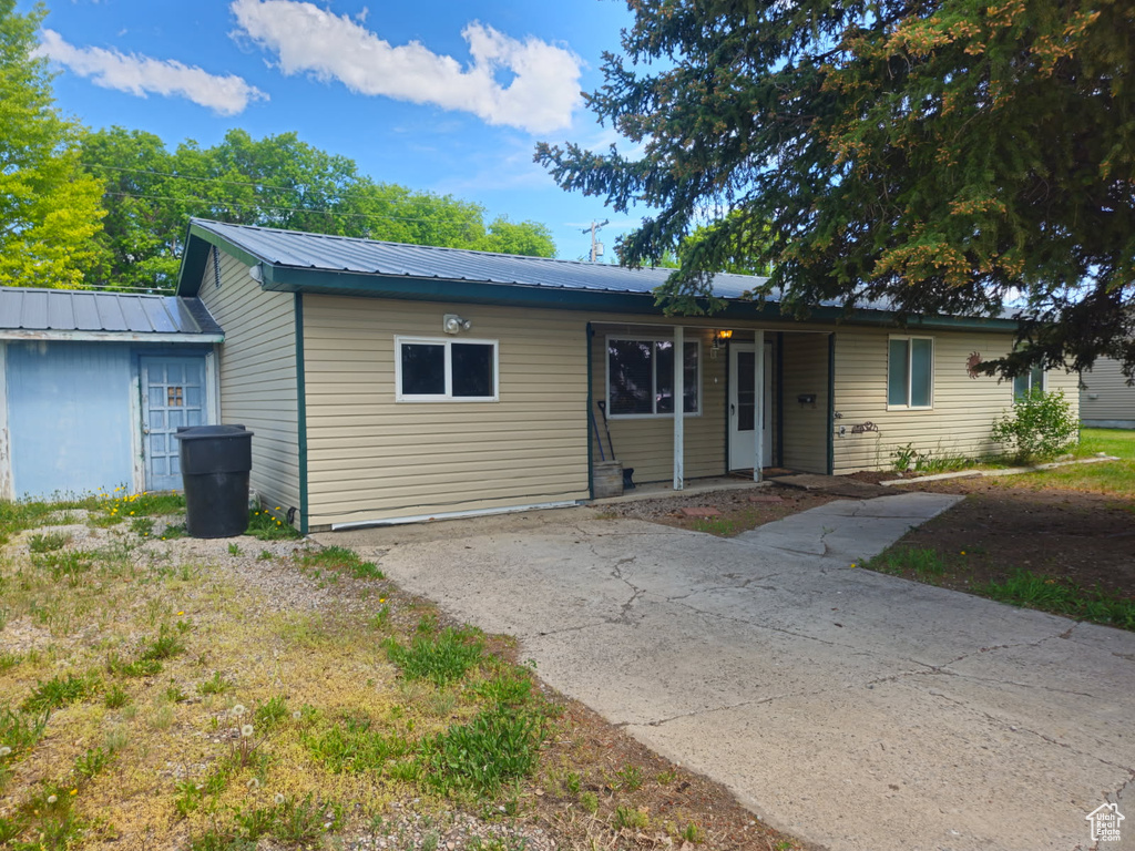 Ranch-style home with metal roof