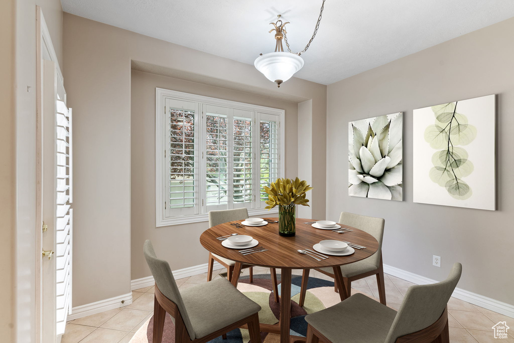 Dining room featuring light tile patterned floors