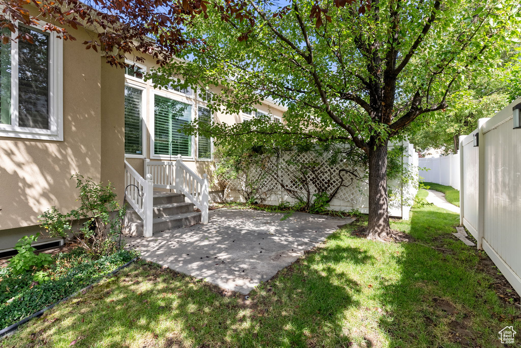 View of yard with a patio