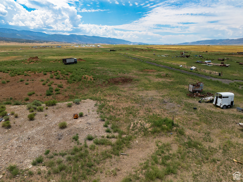 Birds eye view of property with a rural view and a mountain view