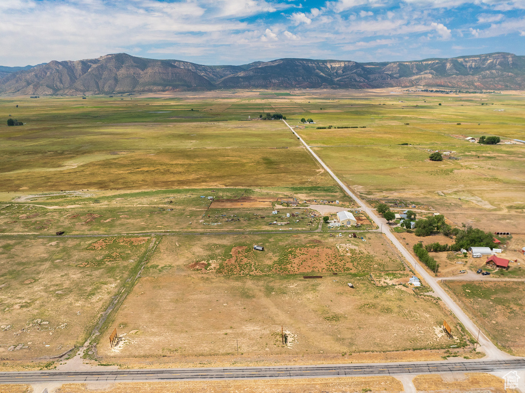 Aerial view featuring a rural view and a mountain view