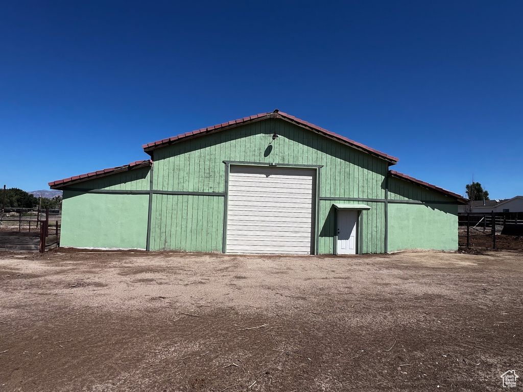 View of outdoor structure with a garage