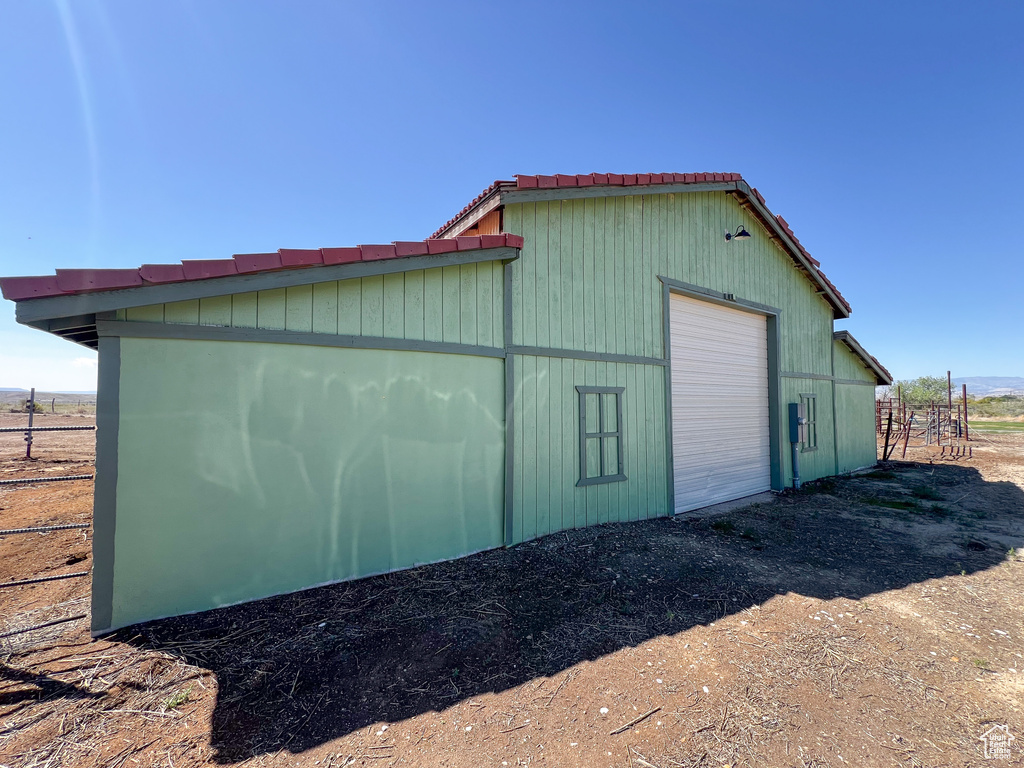 View of outdoor structure featuring a garage