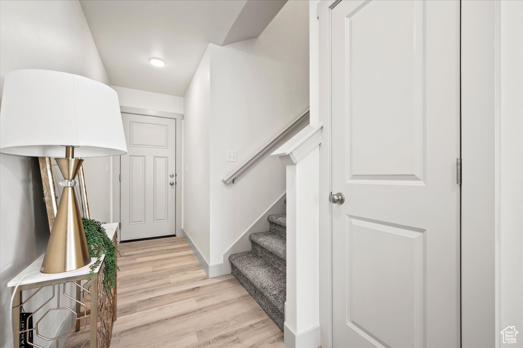 Entryway with light hardwood / wood-style floors