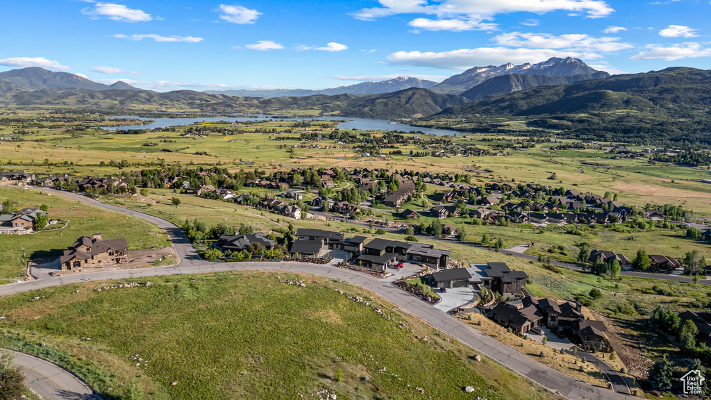 Aerial view featuring a rural view and a water and mountain view