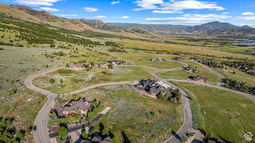 Birds eye view of property with a mountain view