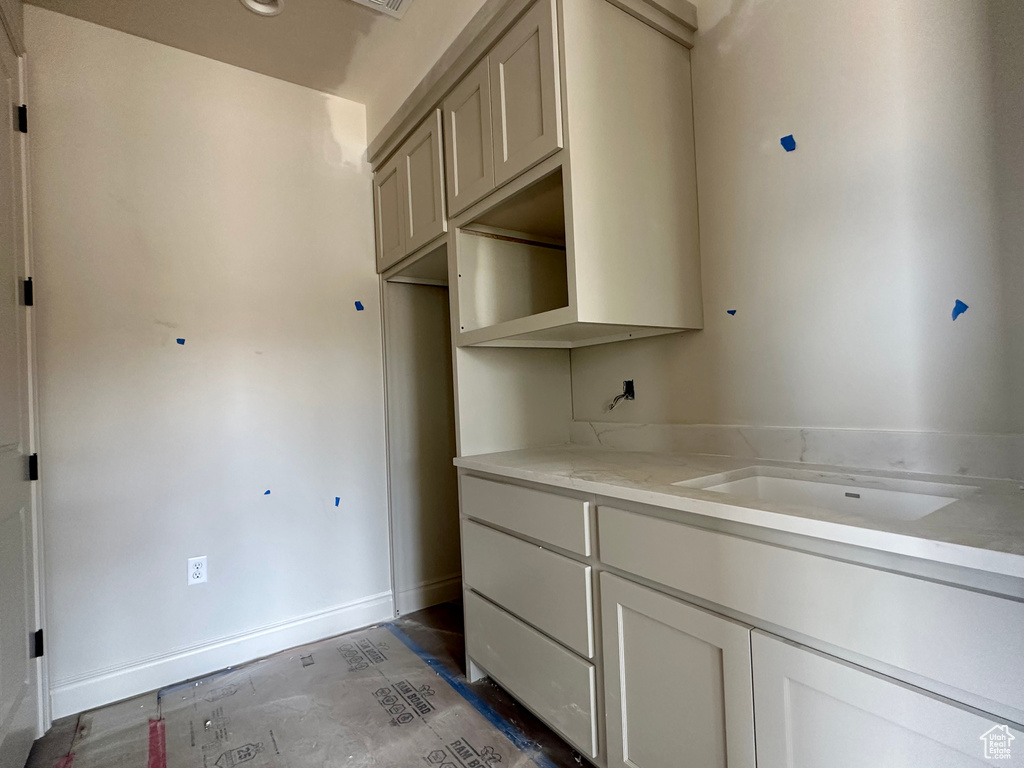 Kitchen featuring light stone countertops