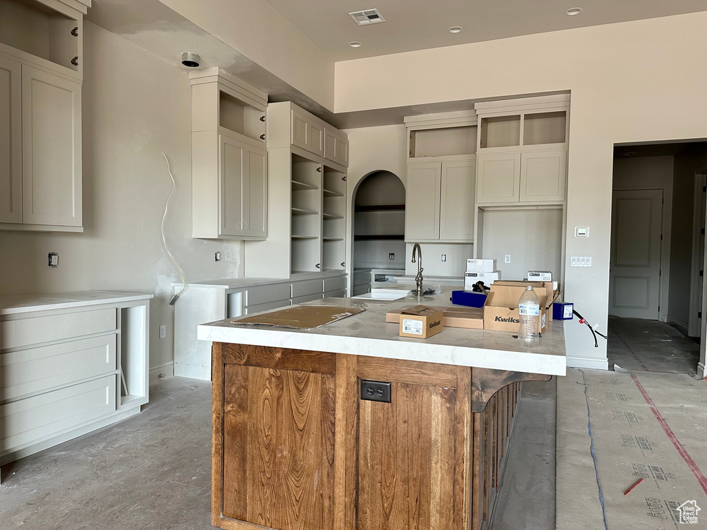 Kitchen featuring sink and a large island with sink