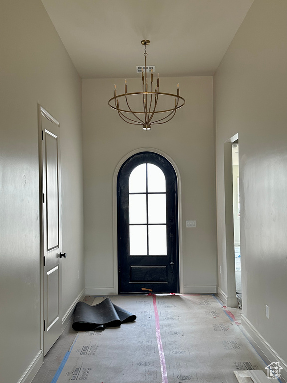 Entrance foyer with a notable chandelier