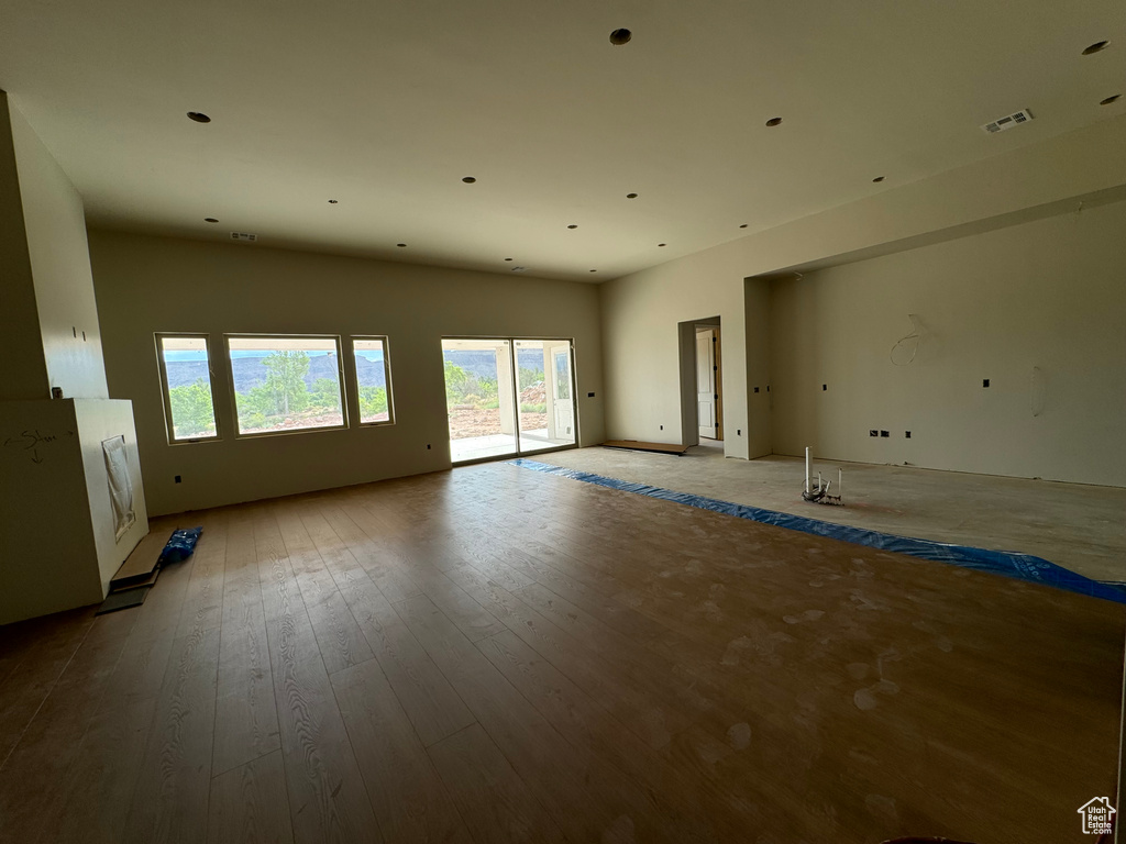 Empty room with hardwood / wood-style floors