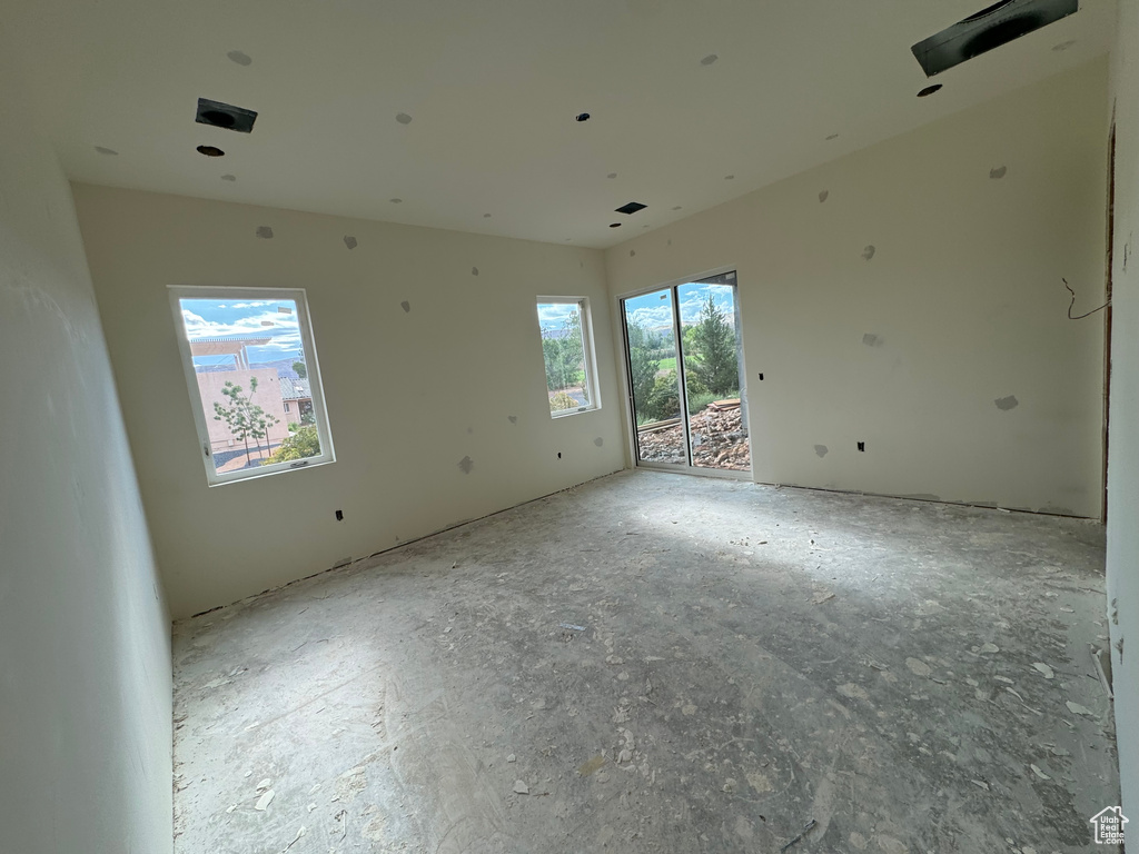 Unfurnished room with plenty of natural light