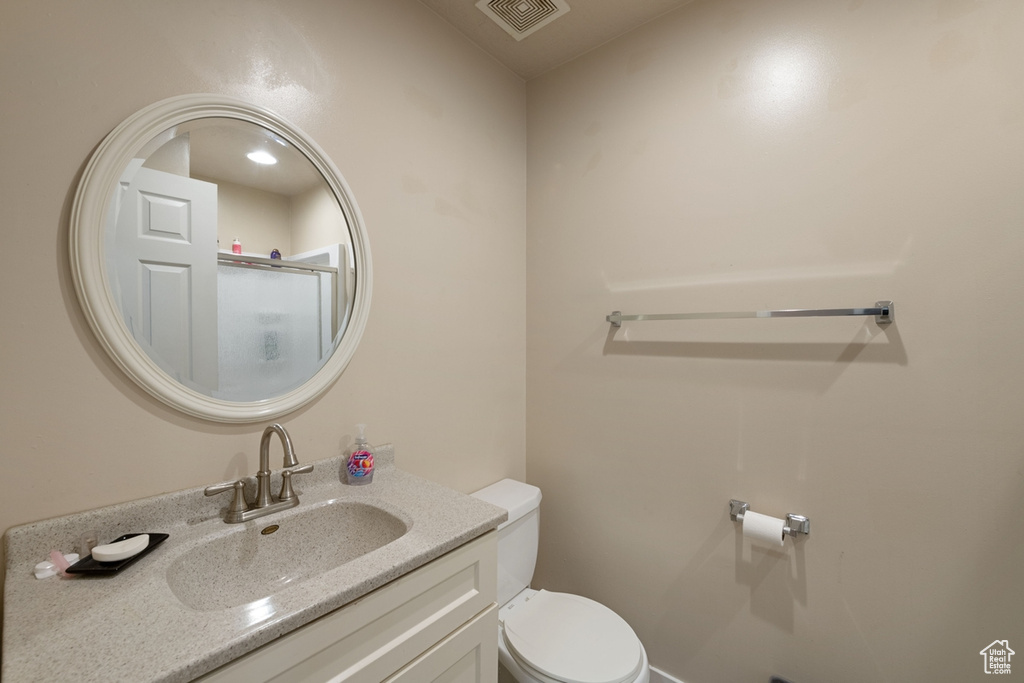 Bathroom with toilet and vanity