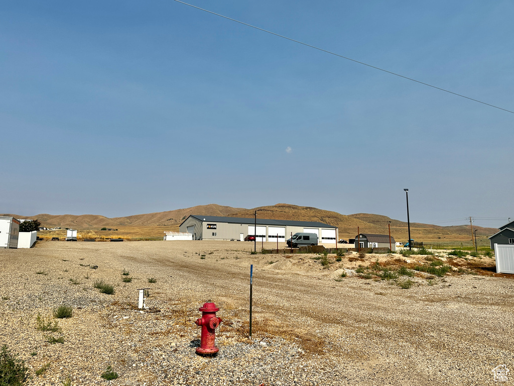 View of yard with a mountain view and a rural view