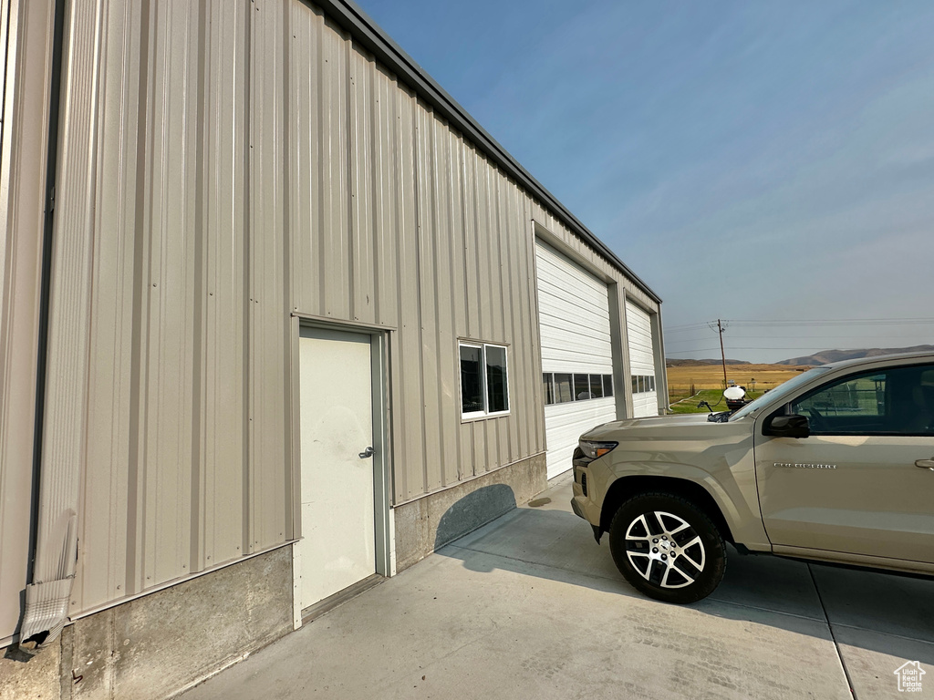 View of property exterior with a garage