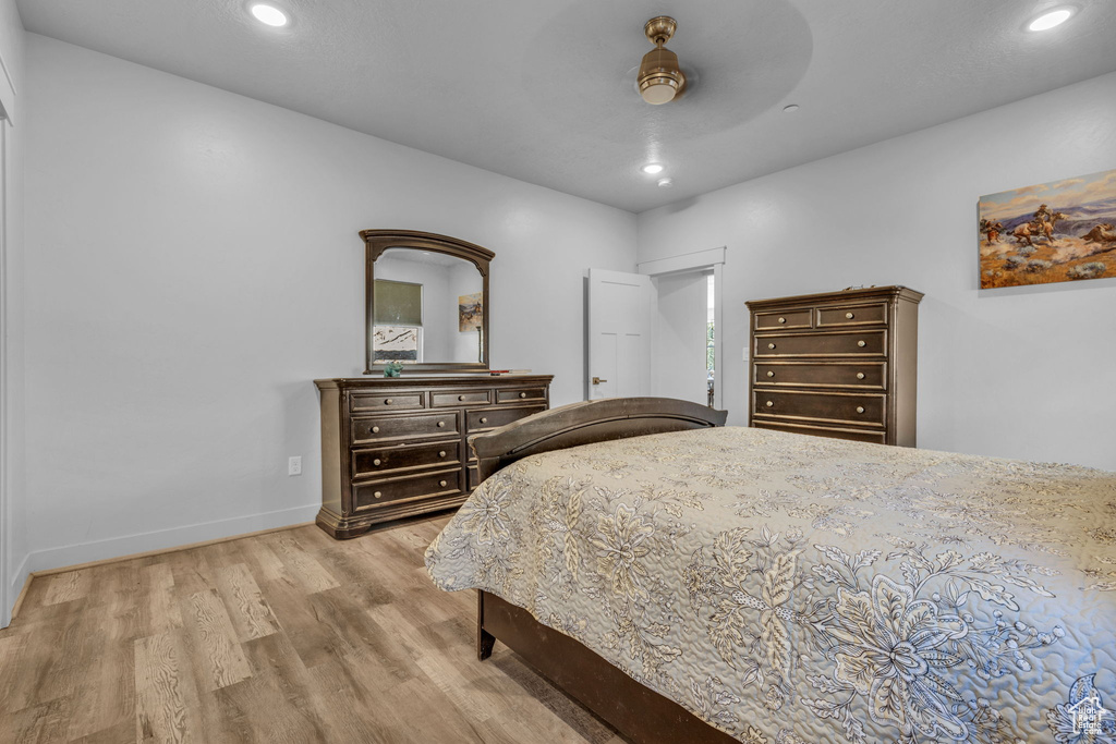 Bedroom featuring light wood-type flooring and ceiling fan