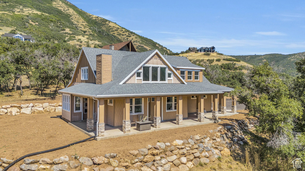 View of front of home with a mountain view