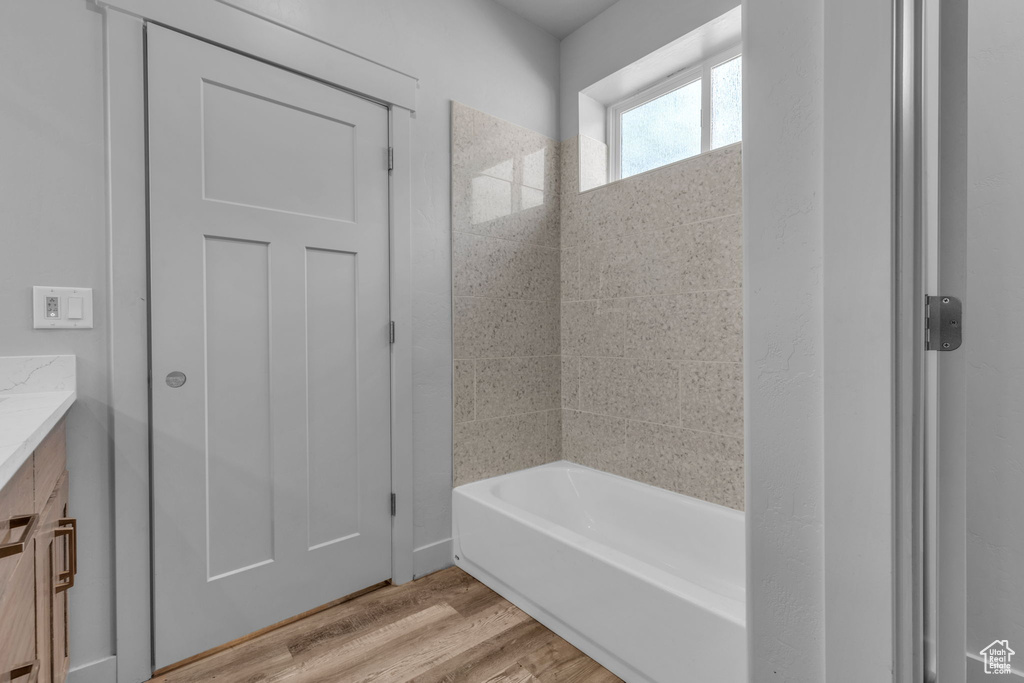 Bathroom featuring hardwood / wood-style flooring and vanity