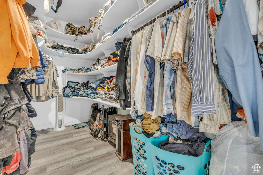 Spacious closet with wood-type flooring