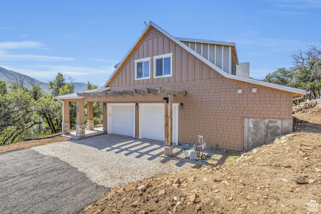 View of side of property with a pergola