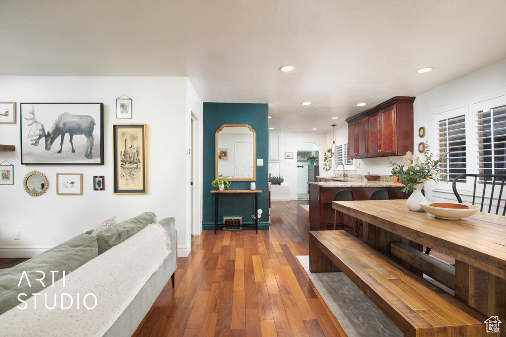 Dining room featuring sink and dark hardwood / wood-style floors