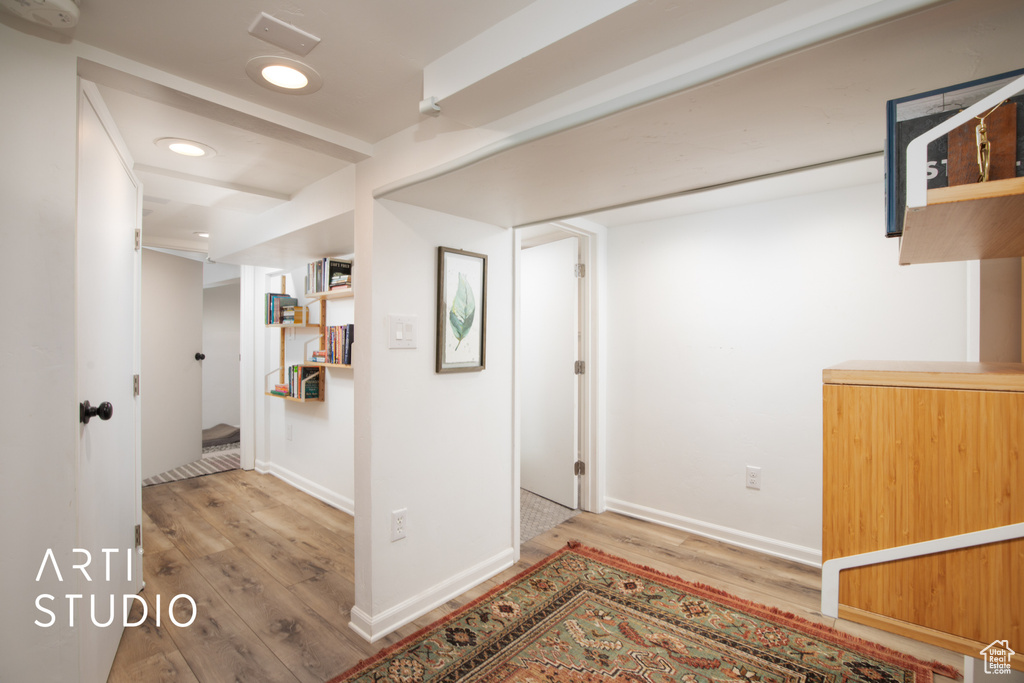 Hallway featuring light hardwood / wood-style flooring