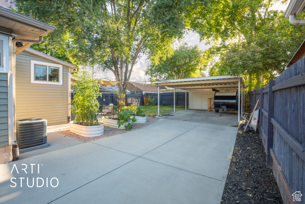 View of patio / terrace featuring a carport and central AC