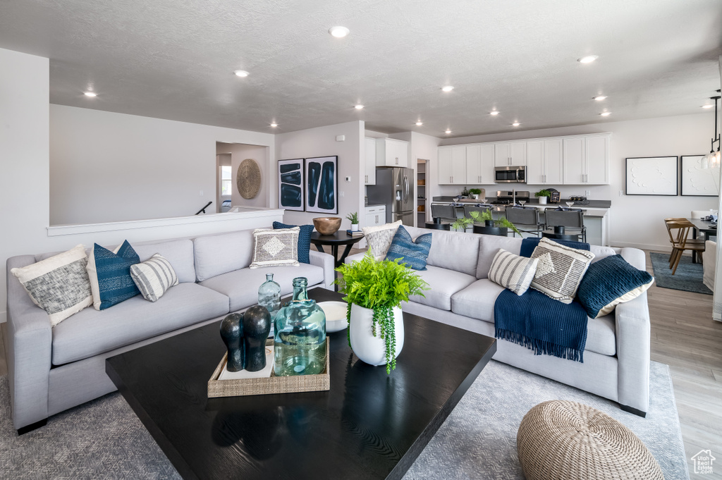 Living room with light wood-type flooring